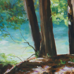A stand of trees in the foreground with bright turquoise and blue highlights on a river flowing gently by in the background.